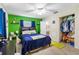 Bedroom with green accent wall, walk-in closet, and bathroom at 4314 Ridge Rd, Lakeland, FL 33811