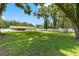 Expansive backyard with large lawn and trees at 4314 Ridge Rd, Lakeland, FL 33811
