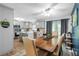 Modern kitchen with gray cabinets, island, stainless steel appliances, and dining area at 4314 Ridge Rd, Lakeland, FL 33811