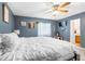 Comfortable bedroom with ceiling fan, king-size bed, and neutral decor at 4314 Ridge Rd, Lakeland, FL 33811