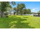 Large backyard with mature trees and plenty of space for play at 4314 Ridge Rd, Lakeland, FL 33811