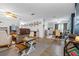 Open concept living and dining area with hardwood floors and a neutral color palette at 4314 Ridge Rd, Lakeland, FL 33811