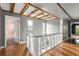 Upstairs hallway with wood floors and exposed beams at 6318 Cedar Ln, Lakeland, FL 33813