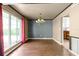 Elegant dining room with chandelier and hardwood floors at 6318 Cedar Ln, Lakeland, FL 33813