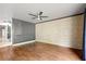 Spacious living room with wood floors and stone wall at 6318 Cedar Ln, Lakeland, FL 33813