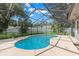 Inviting kidney-shaped pool with screened enclosure at 6318 Cedar Ln, Lakeland, FL 33813