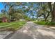 Residential street in a tree-lined community at 6318 Cedar Ln, Lakeland, FL 33813