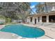 Relaxing kidney-shaped pool with screened enclosure at 6318 Cedar Ln, Lakeland, FL 33813