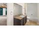 Updated bathroom with granite countertop, dark brown vanity, and a tub shower combo at 6318 Cedar Ln, Lakeland, FL 33813