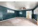 Spacious bedroom with teal walls and carpeted floors at 6318 Cedar Ln, Lakeland, FL 33813