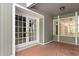 Home's exterior with double doors and brick flooring at 6318 Cedar Ln, Lakeland, FL 33813
