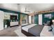 Main bedroom with teal walls and access to balcony at 6318 Cedar Ln, Lakeland, FL 33813