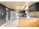 Bright kitchen features granite countertops and gray cabinetry at 6318 Cedar Ln, Lakeland, FL 33813