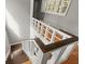 Staircase with wooden railings and open shelving at 6318 Cedar Ln, Lakeland, FL 33813