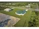 Single-Gathering home with green metal roof at 7031 Red Grange Boulevard Ave, Indian Lake Estates, FL 33855