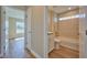 Clean bathroom with tub, toilet and vanity at 7031 Red Grange Boulevard Ave, Indian Lake Estates, FL 33855