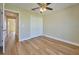 Spacious bedroom with double-door closet and wood-look floors at 7031 Red Grange Boulevard Ave, Indian Lake Estates, FL 33855