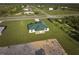 Single-Gathering home with green metal roof at 7031 Red Grange Boulevard Ave, Indian Lake Estates, FL 33855