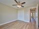 Spacious bedroom with double-door closet and wood-look floors at 7031 Red Grange Boulevard Ave, Indian Lake Estates, FL 33855