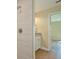 Clean bathroom with a walk-in shower and single vanity at 7031 Red Grange Boulevard Ave, Indian Lake Estates, FL 33855