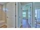 Hallway view of bedroom and bathroom at 7031 Red Grange Boulevard Ave, Indian Lake Estates, FL 33855