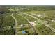 Large community with many houses and green areas at 7031 Red Grange Boulevard Ave, Indian Lake Estates, FL 33855