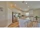 Modern kitchen with stainless steel appliances and granite countertops, offering an island with seating at 7031 Red Grange Boulevard Ave, Indian Lake Estates, FL 33855