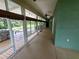 Enclosed patio with windows offering scenic waterfront views at 1211 Cr 436, Lake Panasoffkee, FL 33538