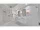 Elegant bathroom with double vanity, marble finishes, and large shower at 231 Riverside Dr # 709, Daytona Beach, FL 32117