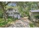 Two houses with driveways, sheds and lush greenery at 3603 Cr 626N, Bushnell, FL 33513