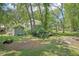 Landscaped backyard with shed, providing additional storage and outdoor space at 3603 Cr 626N, Bushnell, FL 33513