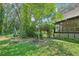 Landscaped backyard with seating area and lush greenery at 3603 Cr 626N, Bushnell, FL 33513