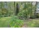Spacious backyard with lush greenery and a charming gazebo at 3603 Cr 626N, Bushnell, FL 33513
