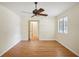 Bright bedroom featuring wood floors and an adjacent bathroom at 3603 Cr 626N, Bushnell, FL 33513