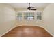 Spacious bedroom with wood flooring and large windows at 3603 Cr 626N, Bushnell, FL 33513