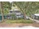 Two-story house surrounded by lush trees at 3603 Cr 626N, Bushnell, FL 33513