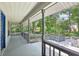 Spacious front porch overlooking a lush green landscape at 3603 Cr 626N, Bushnell, FL 33513