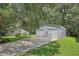 Metal two-car garage with wide driveway, providing convenient parking at 3603 Cr 626N, Bushnell, FL 33513