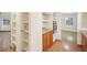 Kitchen boasts ample wood shelving and granite countertops at 3603 Cr 626N, Bushnell, FL 33513