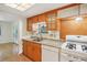 Kitchen features wood cabinets, granite counters, and white appliances at 3603 Cr 626N, Bushnell, FL 33513