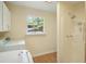 Laundry room includes washer, dryer, and a shower at 3603 Cr 626N, Bushnell, FL 33513