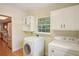Laundry room with washer, dryer and kitchen access at 3603 Cr 626N, Bushnell, FL 33513