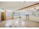 Large living space with exposed beams and light blue walls at 3603 Cr 626N, Bushnell, FL 33513