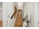 Staircase with wooden handrail and chairlift at 3603 Cr 626N, Bushnell, FL 33513