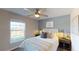 Bright bedroom with a queen-size bed and stylish decor at 2212 Green Valley Ln, Daytona Beach, FL 32124