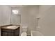 Clean bathroom with dark vanity and white bathtub at 2217 Betsy Ross Ln # A, St Cloud, FL 34769