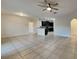Open living room and kitchen area with tile flooring at 2217 Betsy Ross Ln # A, St Cloud, FL 34769