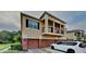 Tan two-story house with two car garage and balcony at 2217 Betsy Ross Ln # A, St Cloud, FL 34769