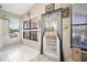 Sunroom with water views, tile floor and plenty of windows at 696 Caribbean Dr, Lakeland, FL 33803