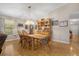 Charming dining room featuring a rustic wooden table and hardwood floors at 696 Caribbean Dr, Lakeland, FL 33803
